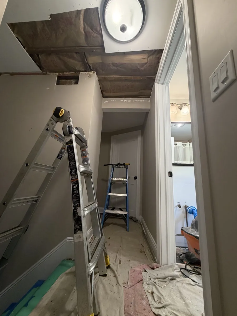Interior hallway ceiling opened for repair before drywall finishing